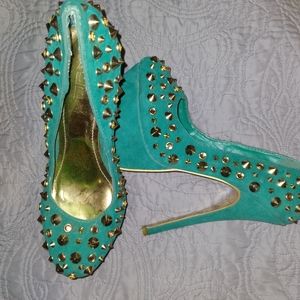 Green spiked heels